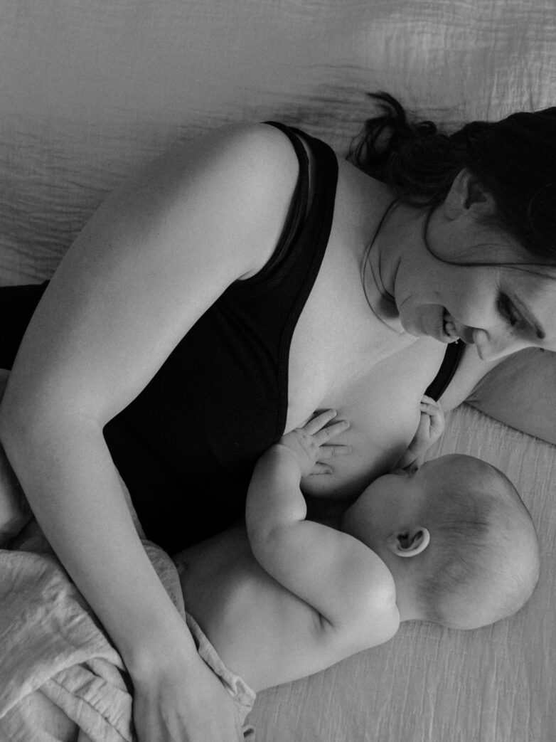 Lactation consultant/mother nursing her baby.