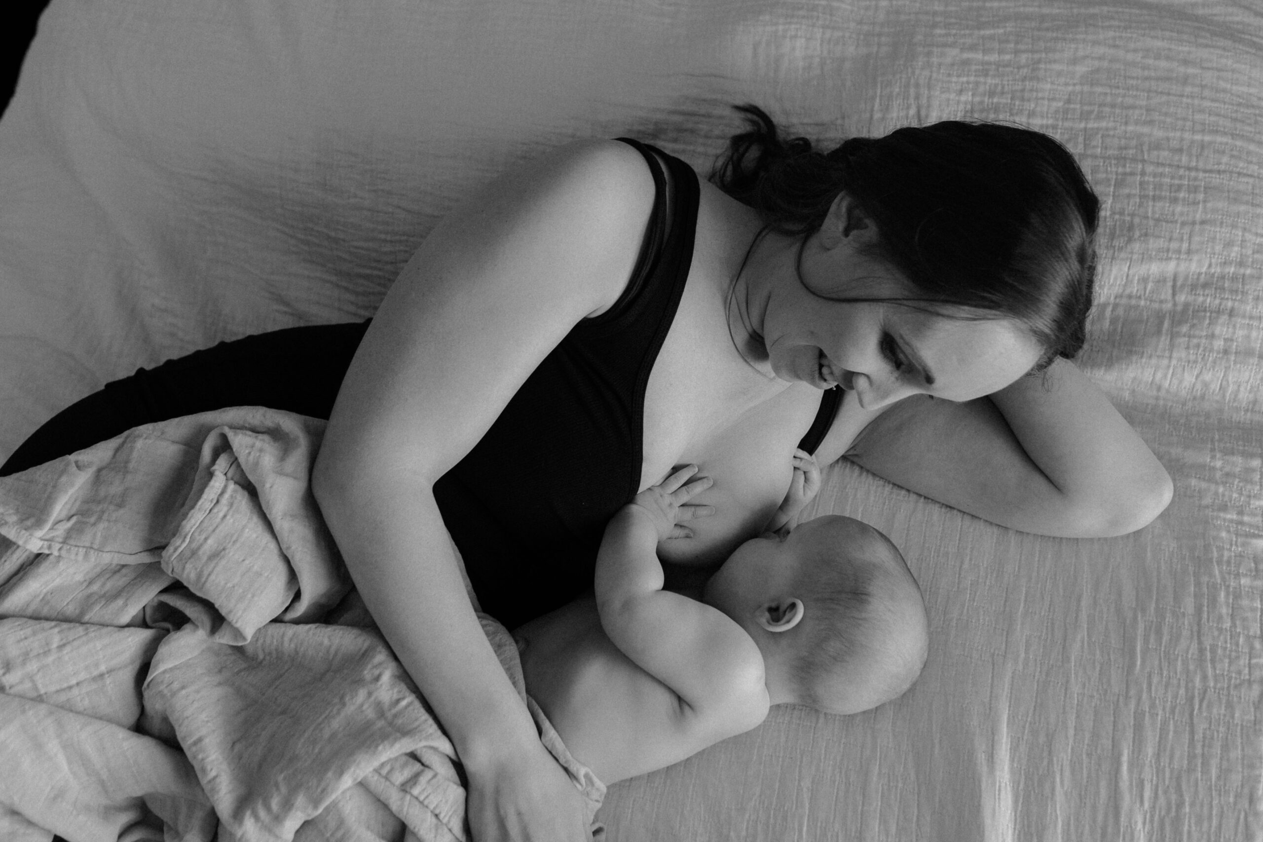 Lactation consultant/mother nursing her baby.
